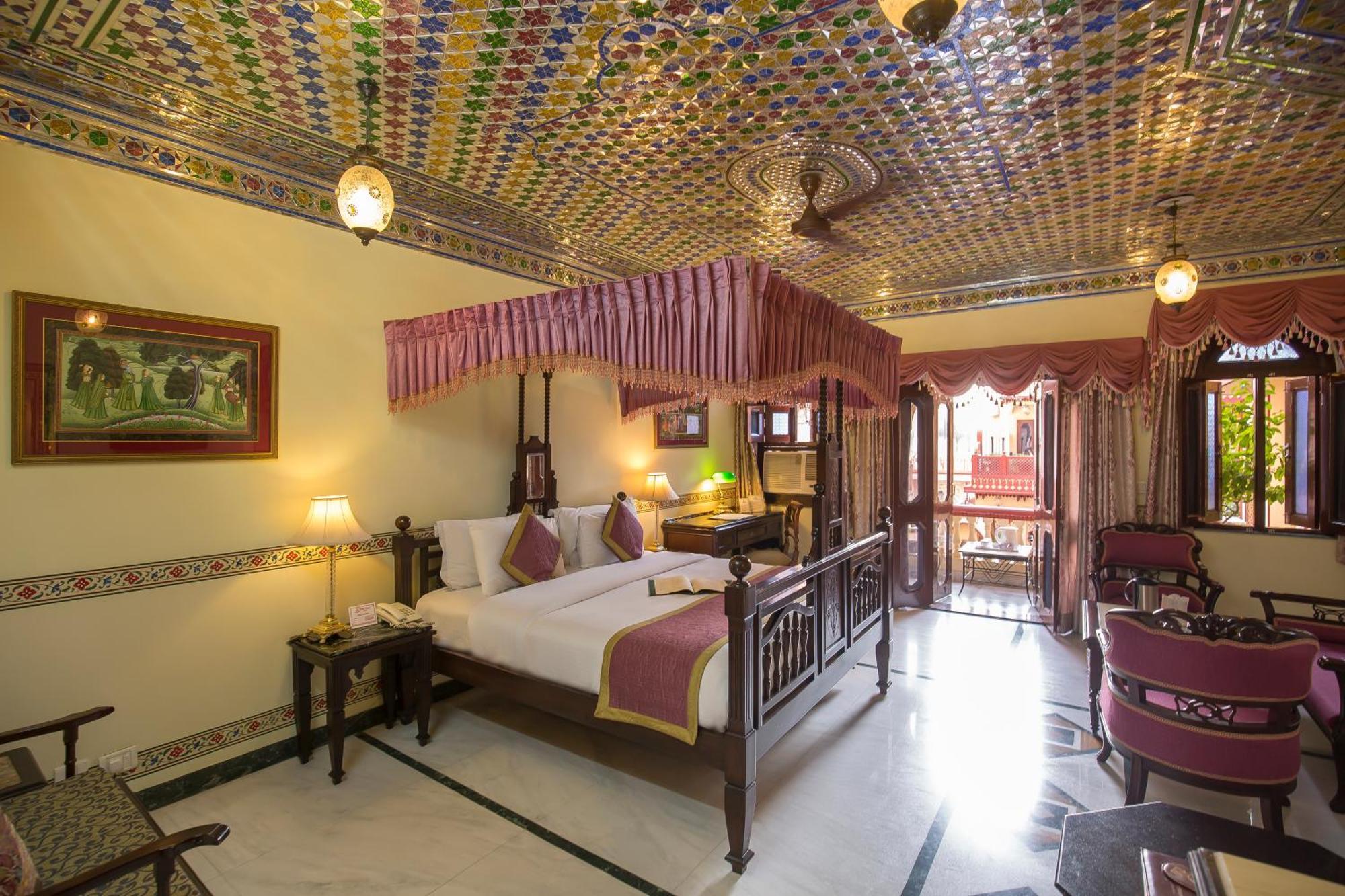 Royal Suite Family: Free pickup on arrival from train or bus station. Enjoy a daily Rajasthani dance & music show from 7–9 PM, swimming pool, and a dedicated travel desk to assist with local sightseeing tours, intercity travel arrangements & activiti